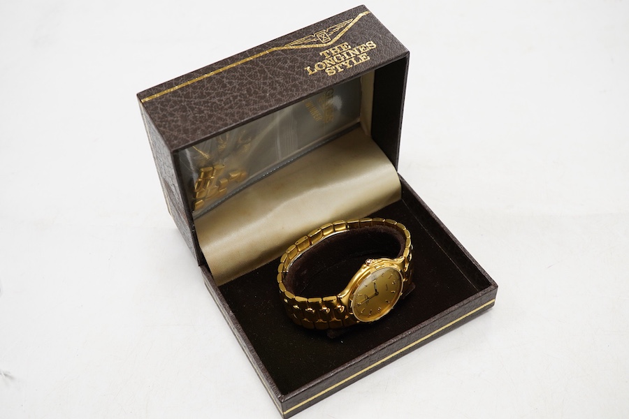 A gentleman's early 1990's stainless steel and gold plated Longines quartz wrist watch, with spare links and box, case diameter 34mm.